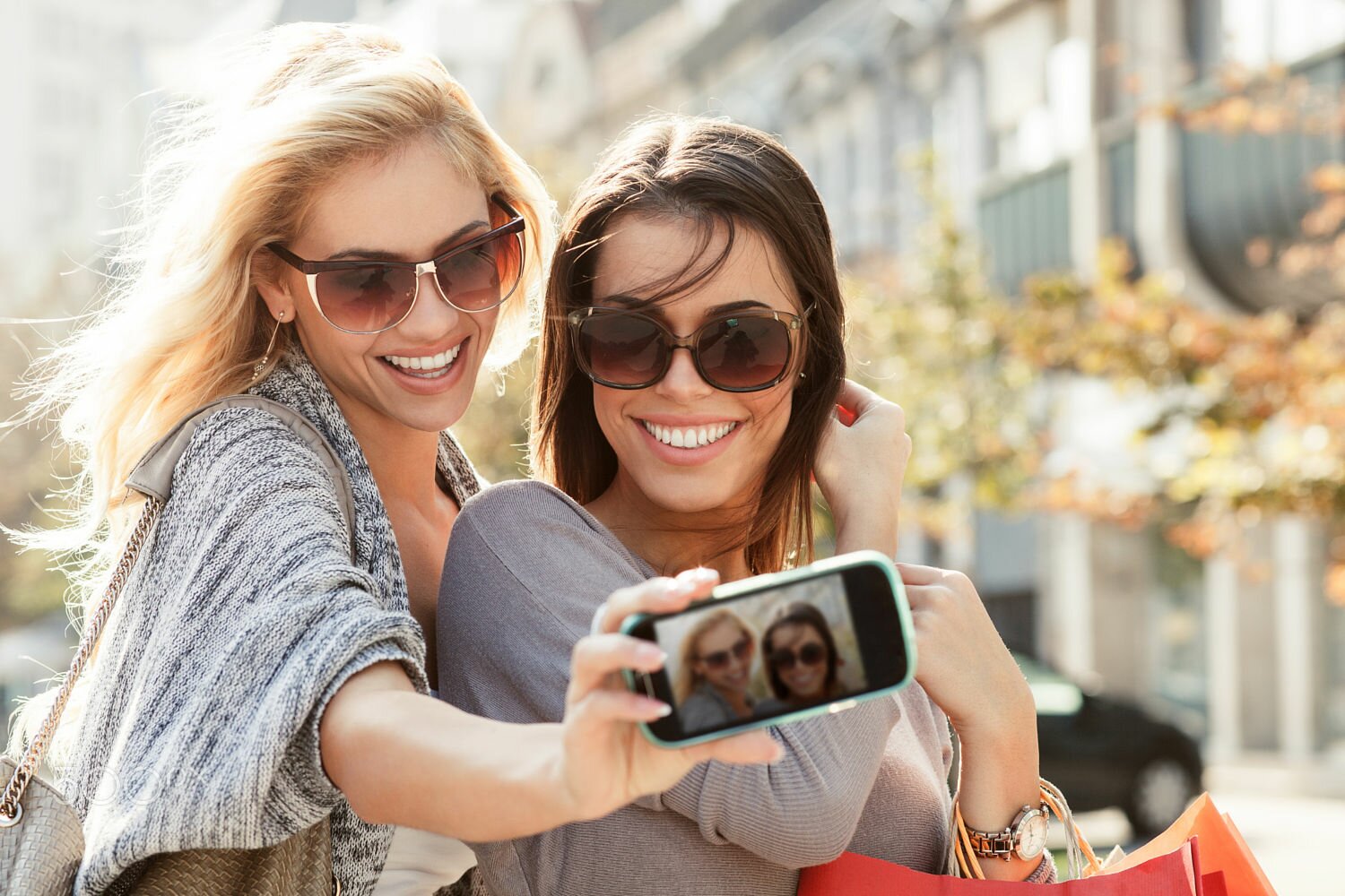 Beautiful blonde and brunette taking a selfie