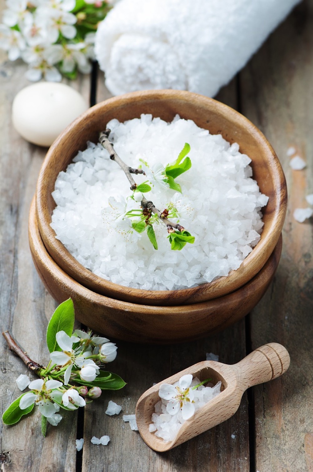 White salt and flowers for spa treatment