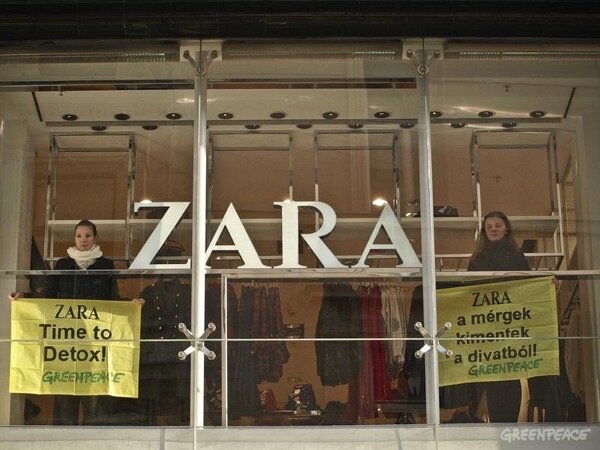 Greenpeace activists protest with banners inside a Zara store in central Budapest. Banners read 'Toxics Are Out Of Fashion!' and 'Zara Time To Detox'. Zara brand clothing products are featured in the Greenpeace report entitled "Toxic Threads - The Big Fashion Stitch-Up" detailing how big brands are forcing consumers to buy clothes that contain hazardous chemicals and that contribute toward toxic water pollution both when they are made, and when they are washed.
